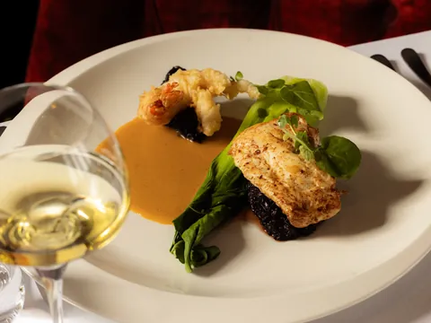 Fish fillet with a crisp prawn, pak choi and a golden sauce
