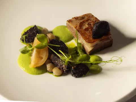 Pressed pork belly with black pudding and pea purée